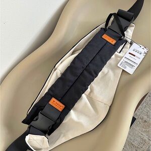 Crossbody Toddler Carrier in Cream and Black